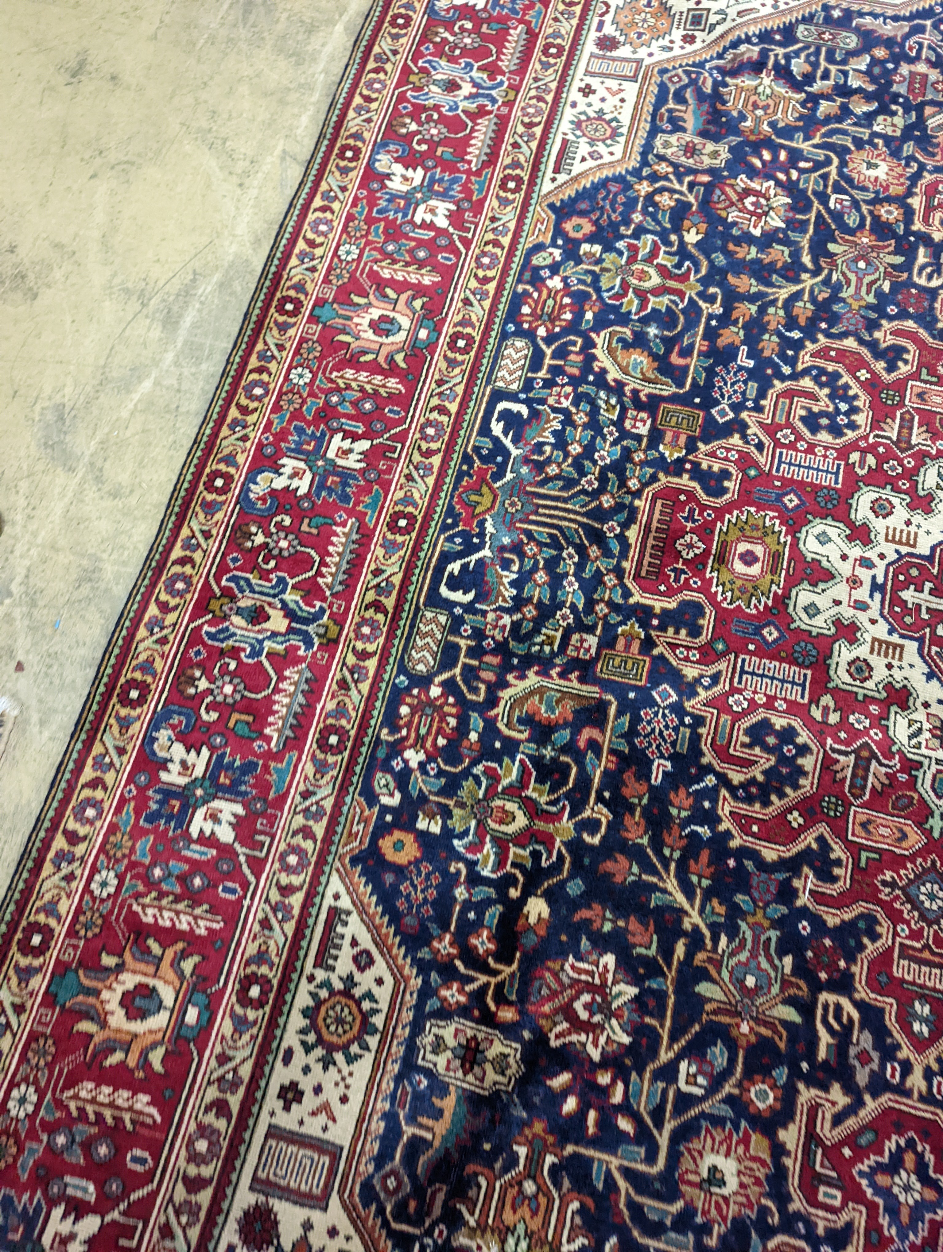 A Tabriz blue ground carpet, 290 x 200cm